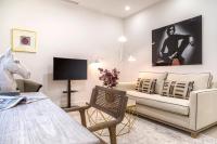 A television and/or entertainment centre at Genteel Home Feria