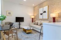 A television and/or entertainment centre at Genteel Home Feria