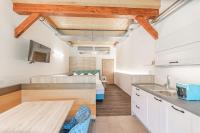 Kuchyň nebo kuchyňský kout v ubytování Chalets am Badesee Lassing