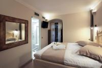 Postel nebo postele na pokoji v ubytování Hotel Doltso
