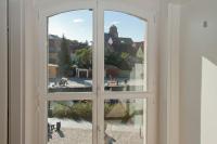 an open window with a view of a city at Der Speicher in Wolgast