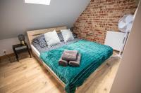 Posteľ alebo postele v izbe v ubytovaní Loft Króla Kazimierza