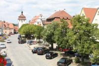 a city street with cars parked on the side of the road at Hotel Gasthof Zum Storch in Schlüsselfeld