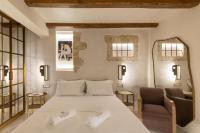 Postel nebo postele na pokoji v ubytování Inotropes Boutique Suites - Adults Only