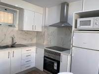 Kuchyň nebo kuchyňský kout v ubytování FANTASTIC APARTMENT. LOS CRISTIANOS. FREE WIFI.