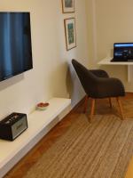 A television and/or entertainment centre at Sea & City views, Aspa’s apartment