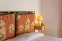Posteľ alebo postele v izbe v ubytovaní Agriturismo Villa Lugnano Casale Con Piscina Privata