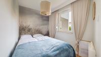 Posteľ alebo postele v izbe v ubytovaní Apartamenty Sun & Snow Baltic Sun z basenem i placem zabaw