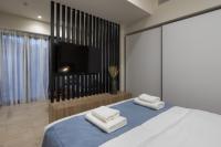 A bed or beds in a room at Hestia - Alexandras 38