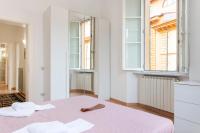 Posteľ alebo postele v izbe v ubytovaní Borgo Stretto Bright Apartments