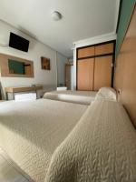 Posteľ alebo postele v izbe v ubytovaní Hotel Alamo