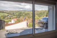 a view from a window of a car parked in a driveway at KASA HOME - Calme, Cosy, WIFI &amp; Netflix in Saint-Martin-la-Plaine