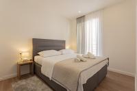 Postel nebo postele na pokoji v ubytování Apartmani Benzon