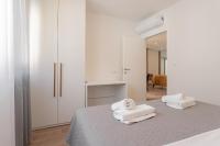 Postel nebo postele na pokoji v ubytování Apartmani Benzon
