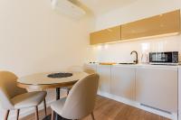 Kuchyň nebo kuchyňský kout v ubytování Apartmani Benzon