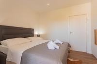 Postel nebo postele na pokoji v ubytování Apartmani Benzon