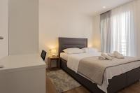 Postel nebo postele na pokoji v ubytování Apartmani Benzon