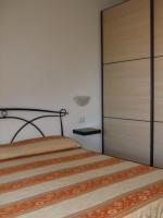 A bed or beds in a room at Oasi Peppa