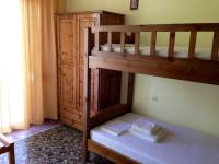 A bed or beds in a room at Hotel Prinos