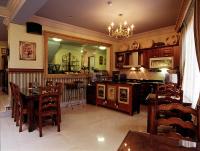 a large kitchen with a table and a dining room at Shangrila Music Villa in Ren&#39;ai