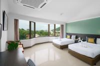 I Pavilion Hotel Phuketにあるベッド