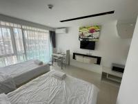 Postel nebo postele na pokoji v ubytování GETAWAY STUDIO in City Center Residence