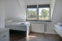Łóżko lub łóżka w pokoju w obiekcie Apartamenty Zielona Lipka
