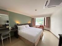 I Pavilion Hotel Phuketにあるベッド