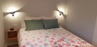 A bed or beds in a room at O Feixoal