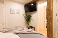 Postel nebo postele na pokoji v ubytování New Abando AC by Staynnapartments