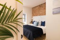 Postel nebo postele na pokoji v ubytování New Abando AC by Staynnapartments