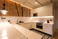 Kuchyň nebo kuchyňský kout v ubytování New Abando AC by Staynnapartments