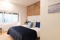 Postel nebo postele na pokoji v ubytování New Abando AC by Staynnapartments