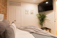 Postel nebo postele na pokoji v ubytování New Abando AC by Staynnapartments