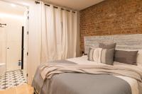 Postel nebo postele na pokoji v ubytování New Abando AC by Staynnapartments