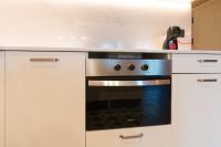 Kuchyň nebo kuchyňský kout v ubytování New Abando AC by Staynnapartments