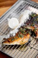 a rack with two pieces of fish on a cooling rack at Encuentro Guadalupe in Valle de Guadalupe