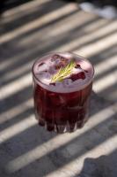 a drink in a glass sitting on a table at Encuentro Guadalupe in Valle de Guadalupe