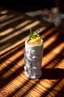 a drink in a cup sitting on a table at Encuentro Guadalupe in Valle de Guadalupe