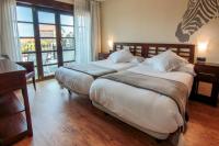 A bed or beds in a room at Apartamentos Costa Esmeralda