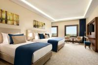 A bed or beds in a room at Ramada by Wyndham Yalova