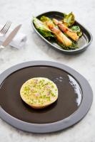 um biscoito em um prato ao lado de um prato de legumes em Sezz Saint-Tropez em Saint-Tropez