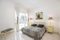 A bed or beds in a room at Menorca Villa Marbella