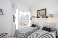 A bed or beds in a room at Menorca Villa Marbella