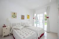 A bed or beds in a room at Menorca Villa Marbella