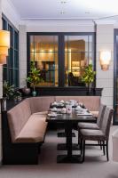 a living room with a couch and a table at COURT HOTEL in Halle Westfalen