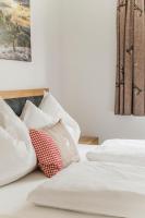 Posteľ alebo postele v izbe v ubytovaní Dachstein West Apartments