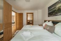 Posteľ alebo postele v izbe v ubytovaní Dachstein West Apartments