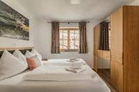 Posteľ alebo postele v izbe v ubytovaní Dachstein West Apartments