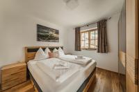Posteľ alebo postele v izbe v ubytovaní Dachstein West Apartments